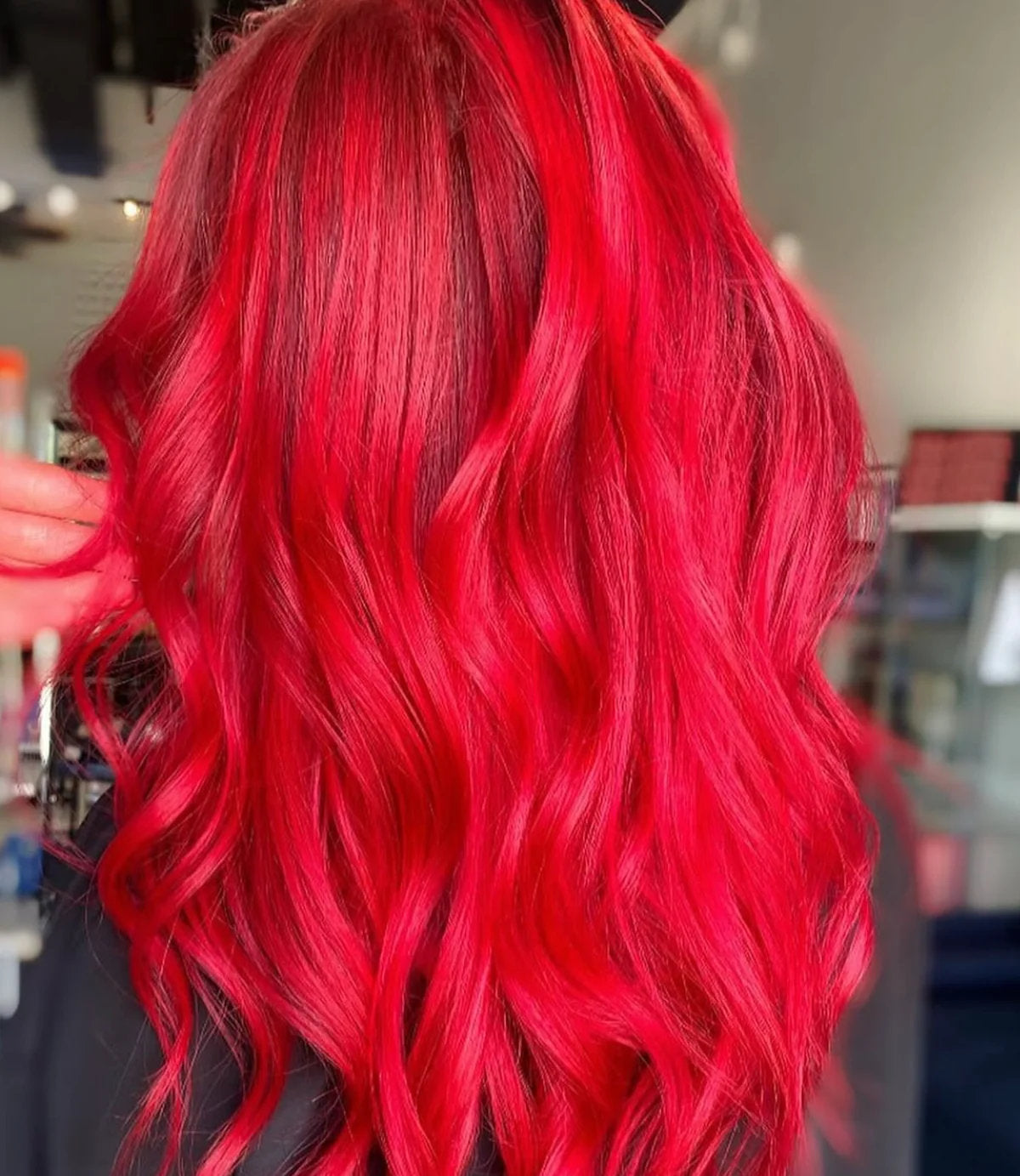 Vibrant all-over red hair color at Hello Beautiful Signature Salon, Missouri City TX