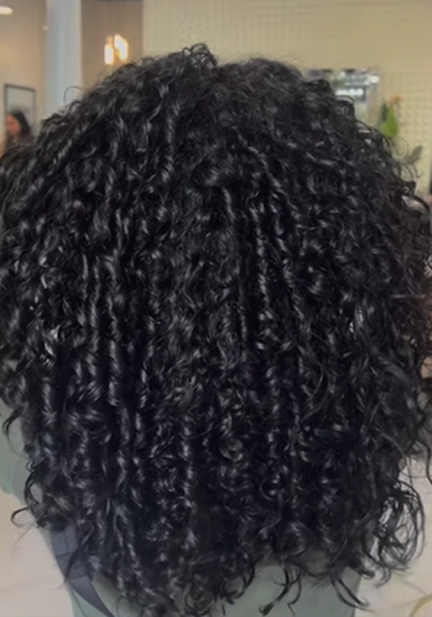 Defined natural curls after a curly cut at Hello Beautiful Signature Salon, Missouri City TX
